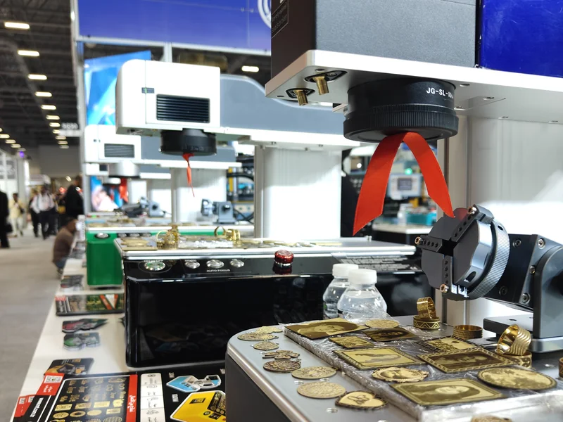 NRT fiber laser marking machine with laser-engraved gold plates, coins and rings — IJS 2026