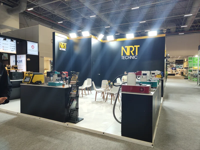 NRT Technic booth at IJS 2026 — XRF gold analyzer, fiber laser marking machines and meeting area at Hall 5, Booth 5G40
